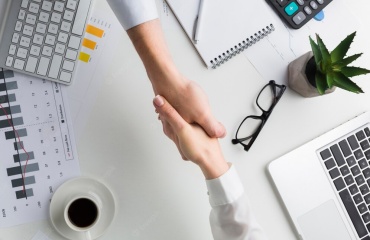 top-view-handshake-work-desk_23-2148397898-0277fdf47ff39b06d690b95002195d54.jpg